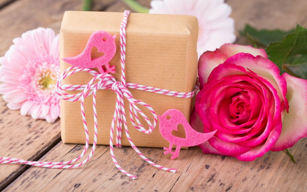 Enchanting Blooms: Captivating Pink Roses Showered in Petals - A Romantic Gift of Flowers - HD Wallpaper Background