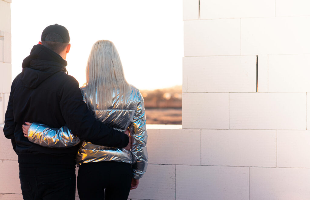Through the Window: Capturing a Sweet Moment of Love and Serenity Wallpaper