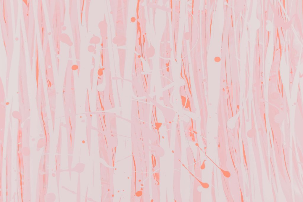 Romantic soft pink abstract wallpaper with vertical fluid streaks and delicate paint splatters