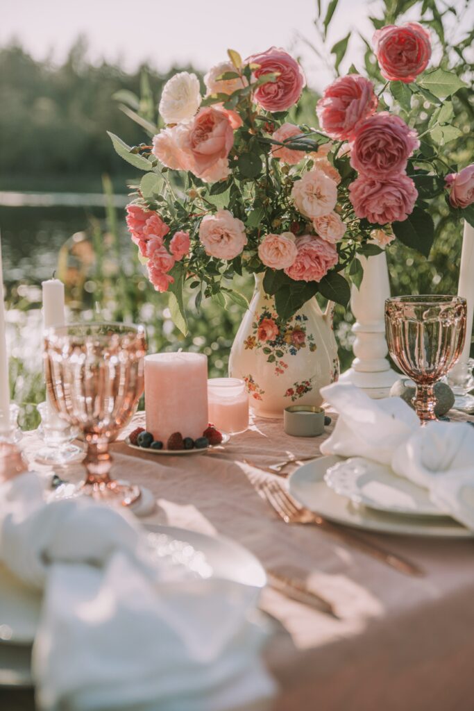 Romantic Table Setting with Roses: Elegant Outdoor Background Wallpaper