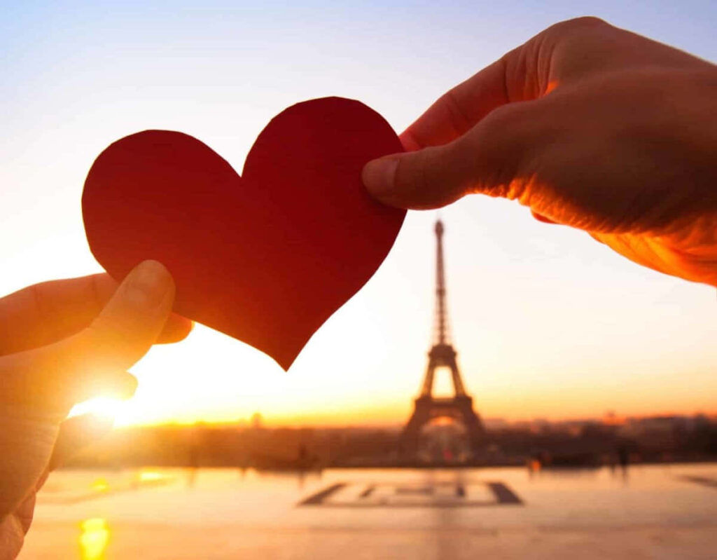 Valentine's Day Love: Hands Holding Heart with Eiffel Tower Sunset Wallpaper