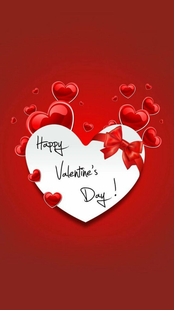 White heart with red bow and Happy Valentines Day message surrounded by shiny red hearts Wallpaper