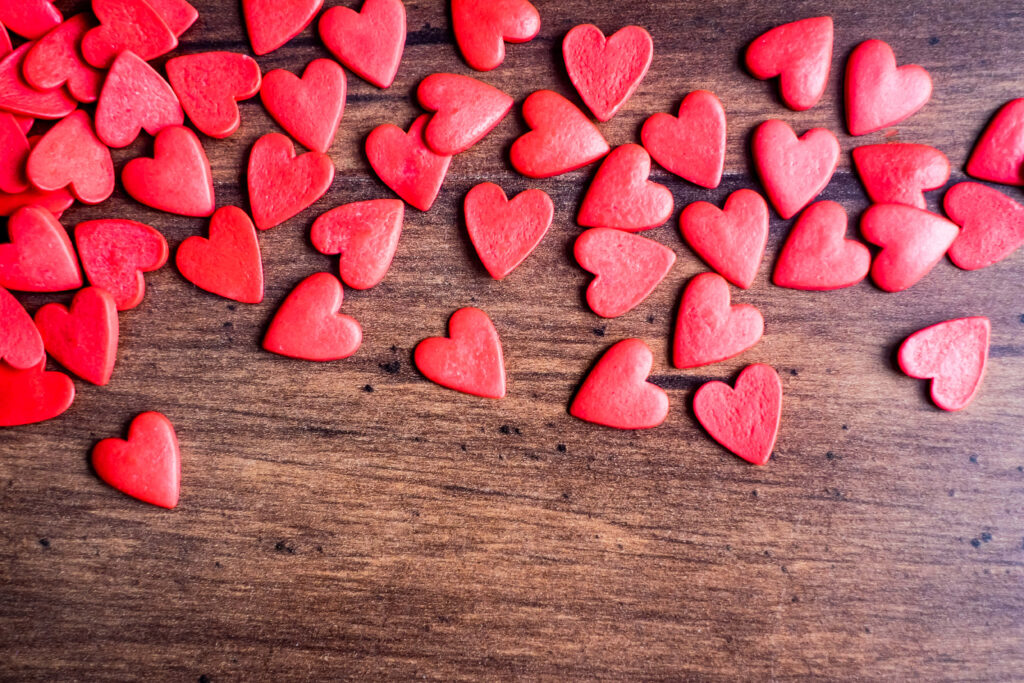 Romantic Valentine's Day Wallpaper: Wooden Table with Heart Decor