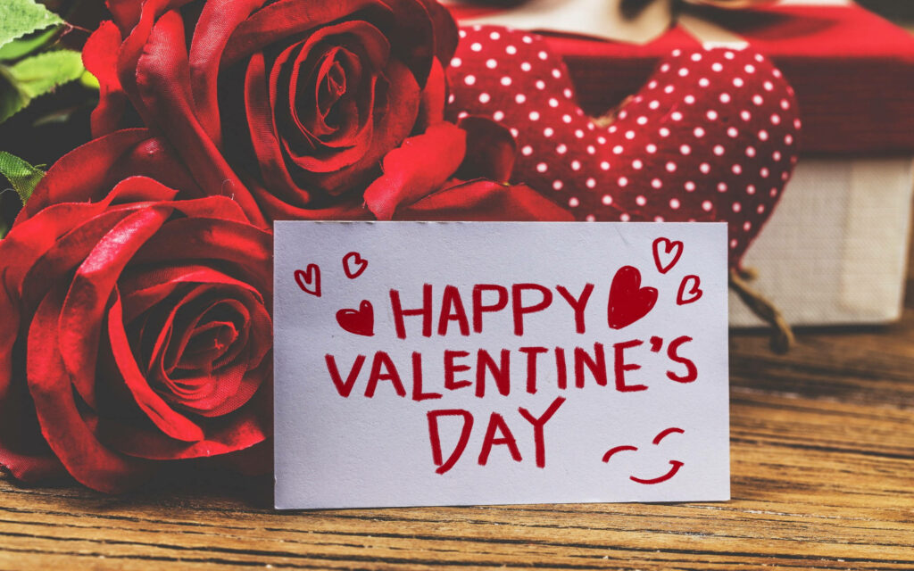 Happy Valentines Day card with red roses and heart shaped gift romantic love wallpaper background