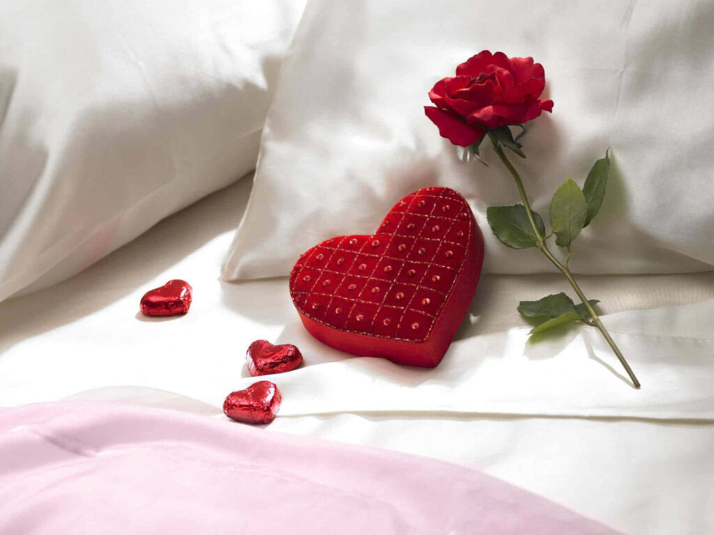 Romantic Wallpaper: Heart Cushion, Chocolates & Red Rose on Bed
