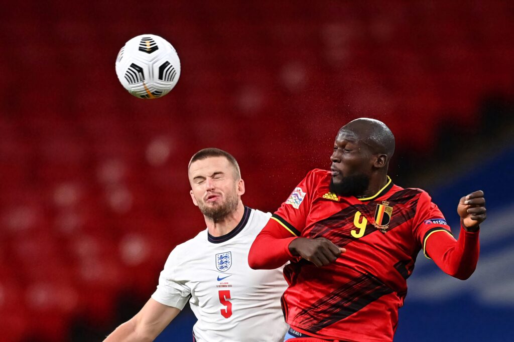 Romelu Lukaku and Eric Dier heading the ball in intense Belgium vs England football match wallpaper