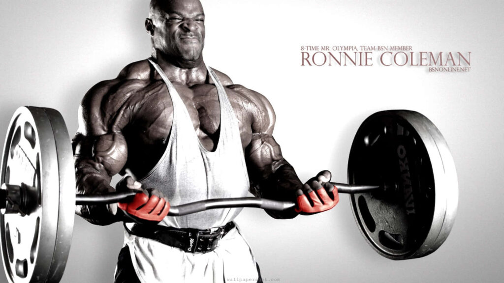 Ronnie Coleman lifting heavy barbell showing strength dedication and perfect physique workout Wallpaper