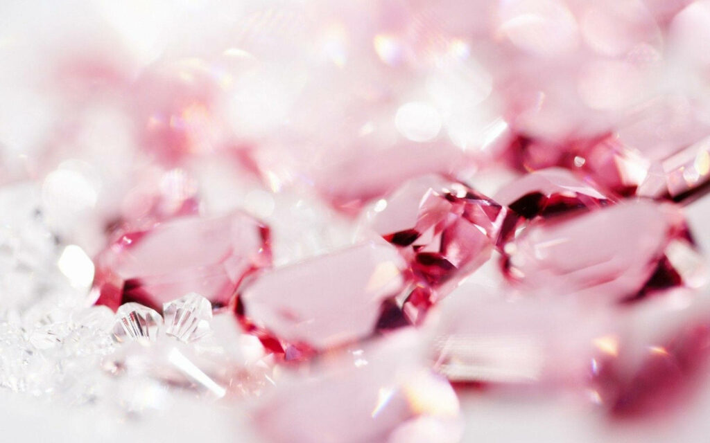 Rose pink faceted crystals cluster with soft shimmering light high resolution macro wallpaper