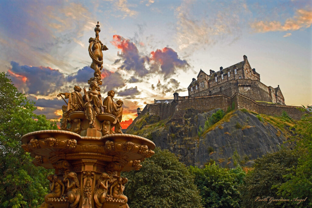 Ross Fountain with golden sculptures in front of Edinburgh Castle at vibrant sunset sky background Wallpaper