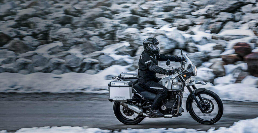 Sleek Royal Enfield Himalayan: Adventure Touring in Snowy Mountains Wallpaper