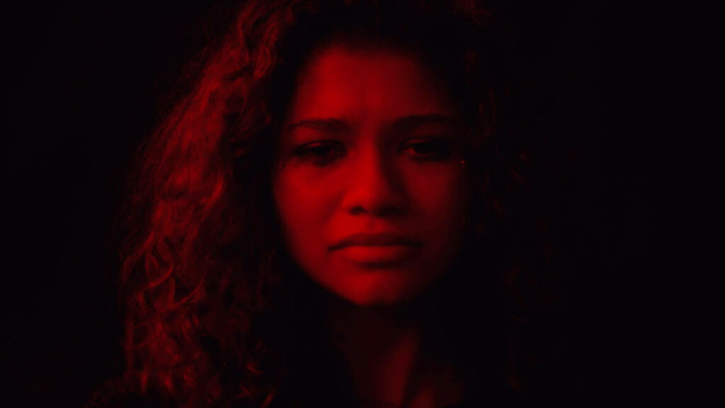 Rue Bennett Euphoria Wallpaper: Dramatic Red Light Background