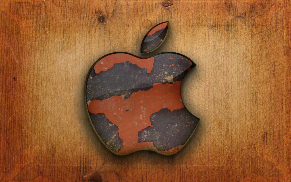 Textured Apple Logo on Rustic Brown Wooden Wallpaper Background