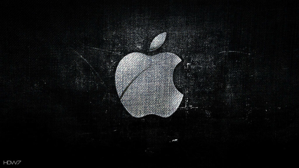 Rugged Elegance: The Striking White Apple Logo against Distressed Black Denim - Unique Black Desktop Background Wallpaper