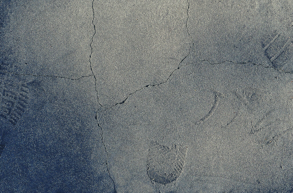 Urban Rugged Concrete Texture Wallpaper with Cracks & Footprints