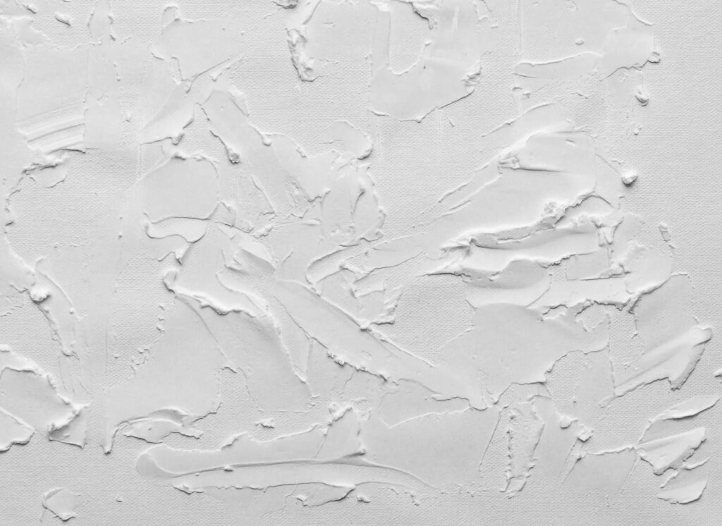 Raw and Textured: A Minimalist Desktop Wallpaper Showcasing a White Plastered Wall with Uneven Strokes and Rough Texture