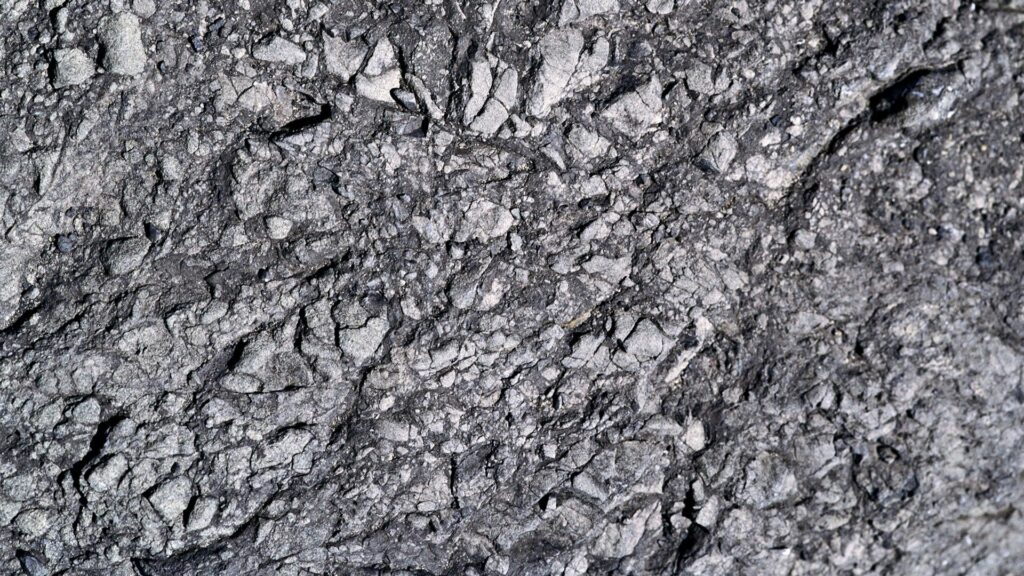 High-resolution rugged gray stone surface with natural cracks and detailed rock texture background Wallpaper