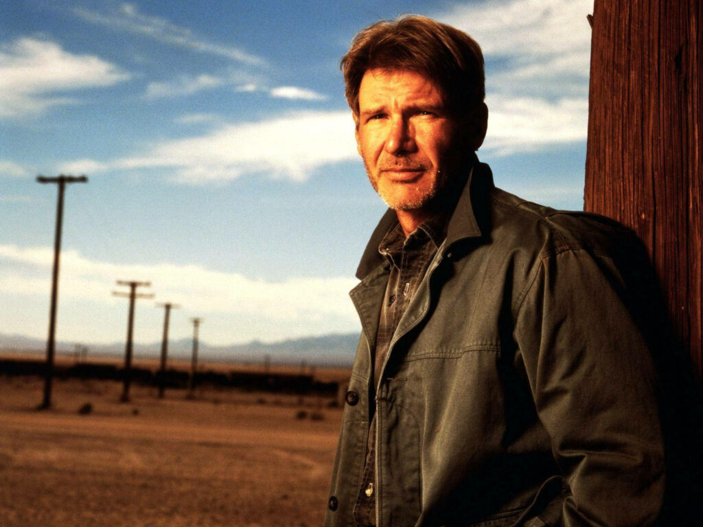 Rugged Indiana Jones Wallpaper: Adventure in a Desert Landscape