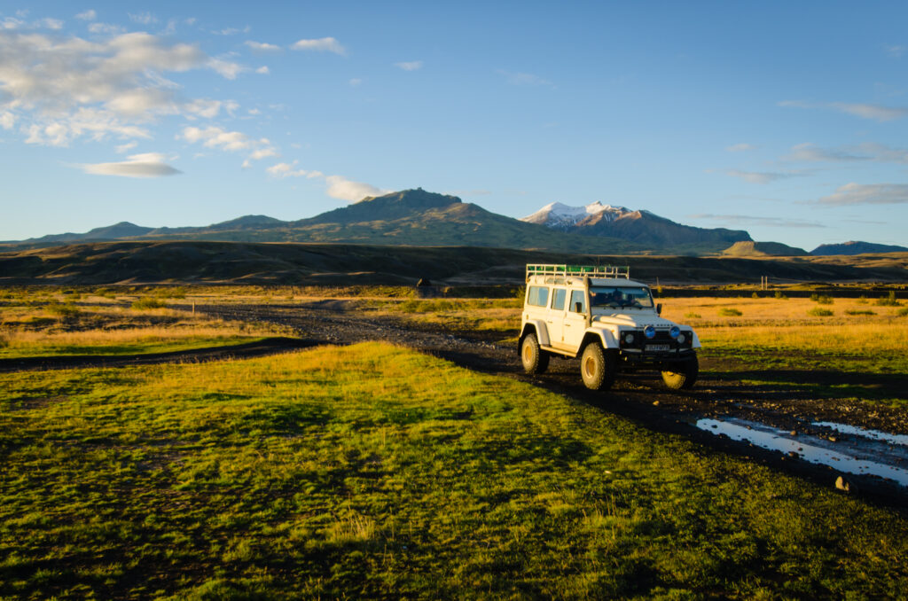 Rugged Land Rover SUV in Scenic Mountain Landscape Wallpaper
