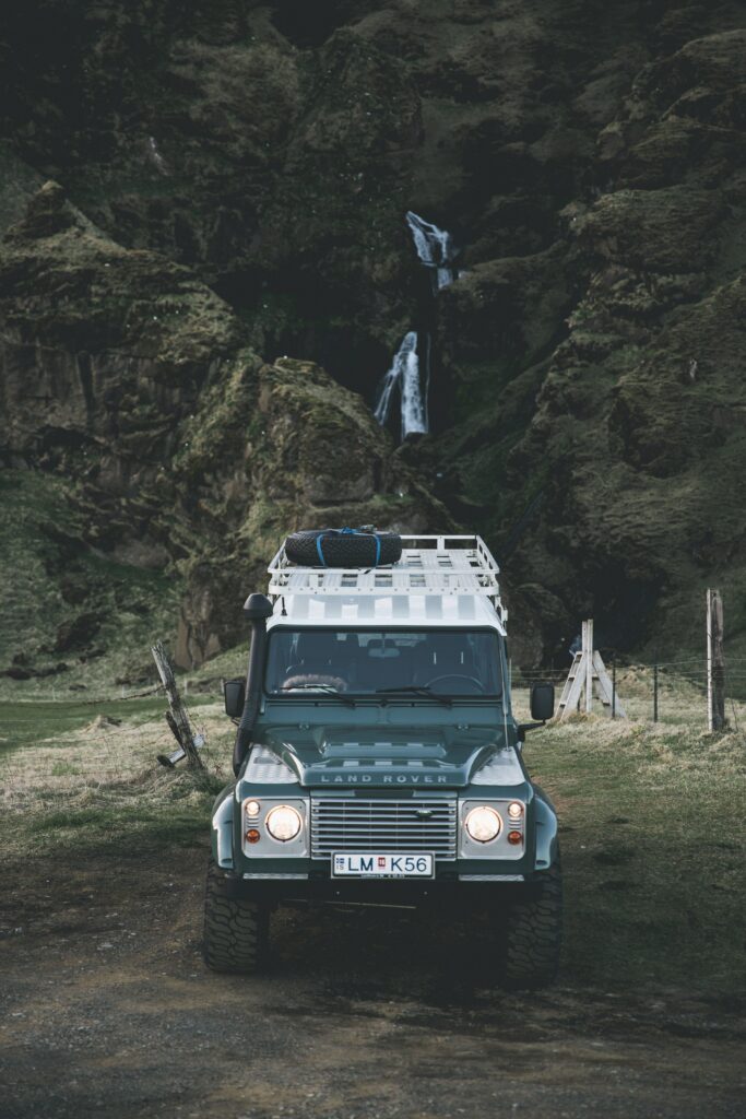 Adventure Awaits: Rugged Land Rover SUV in Scenic Mountain View Wallpaper