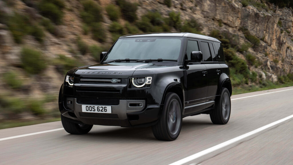 Thrilling Land Rover Defender Wallpaper: Off-Road Adventure Background