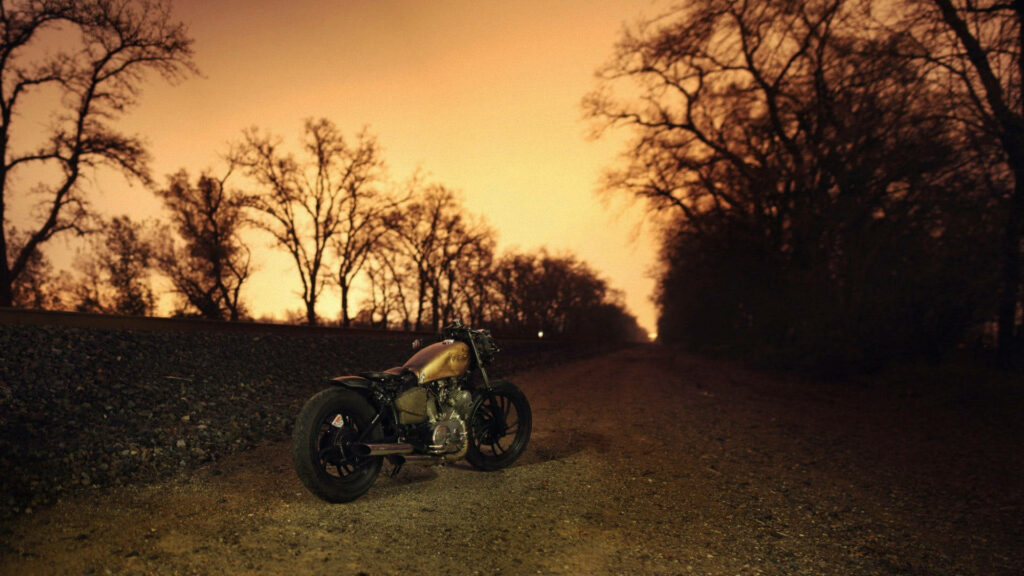 Rugged Rat Bike Bobber Wallpaper: Rustic Evening Road Scene