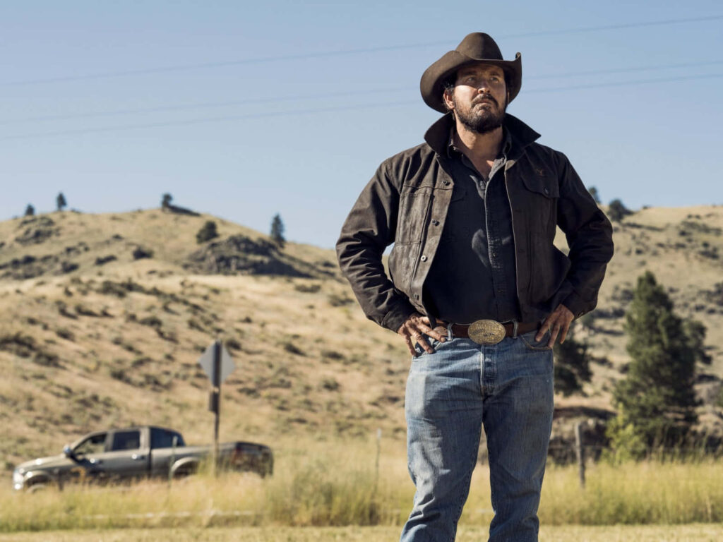 Rip Wheeler in Rugged Countryside - Yellowstone Wallpaper Background