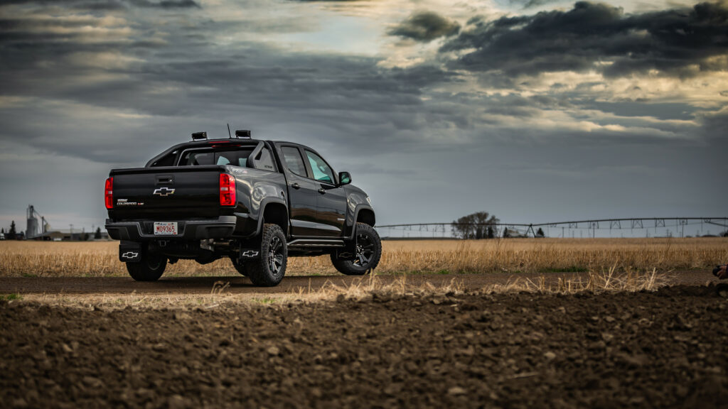 Rugged SUV Wallpaper: Adventure Awaits in a Dramatic Field