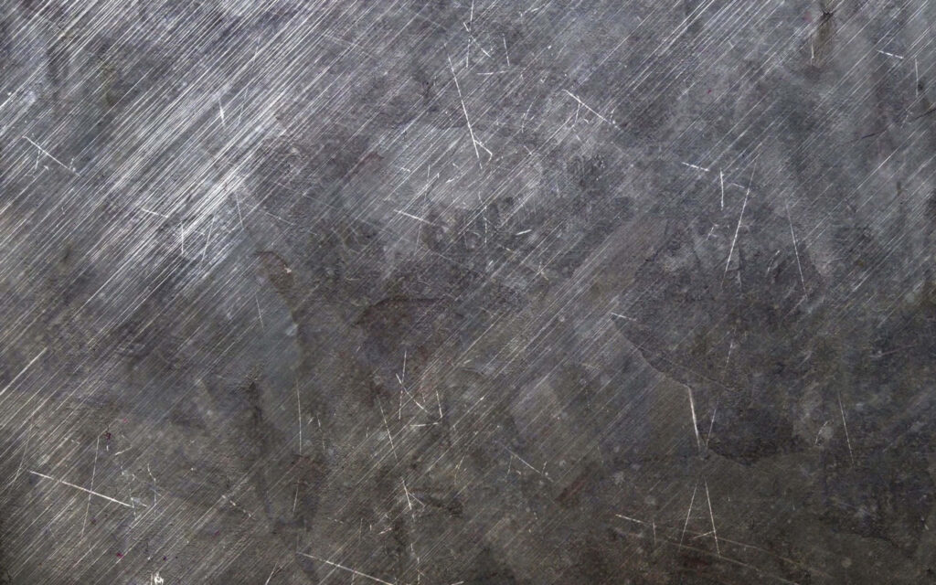 Rugged Wallpaper: Scratched Metal Surface for an Industrial Aesthetic