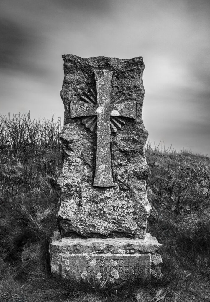 Rugged Stone Monument Wallpaper: Dramatic Black & White Background