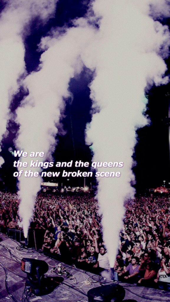 Reigning Over the Broken Scene: Bold Anthem Amidst a Smoky Concert Wallpaper