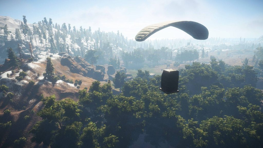 Rust game supply drop parachuting over snow-covered forest loot crate wallpaper background