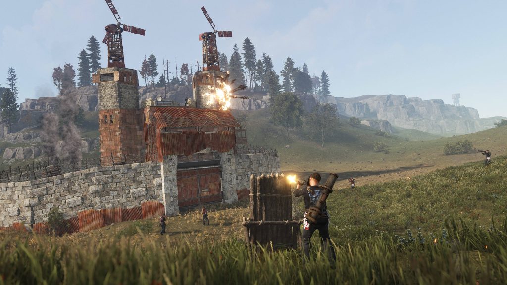 Rust game wallpaper intense survival combat player firing rocket at fortified base with windmills