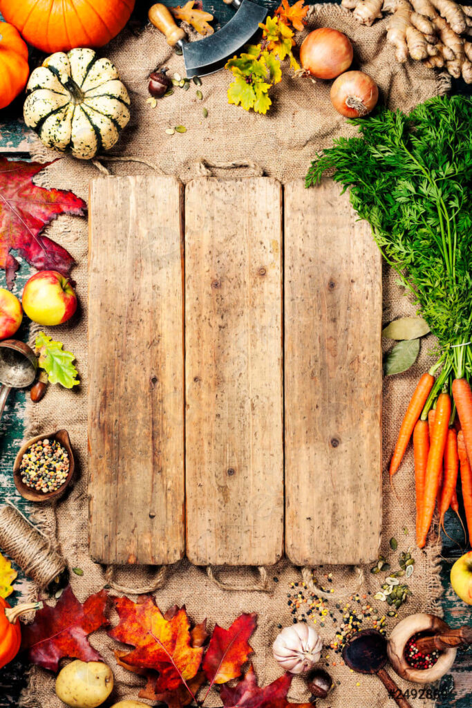 Autumn Harvest: Rustic Wooden Board with Fresh Vegetables & Fruits Wallpaper