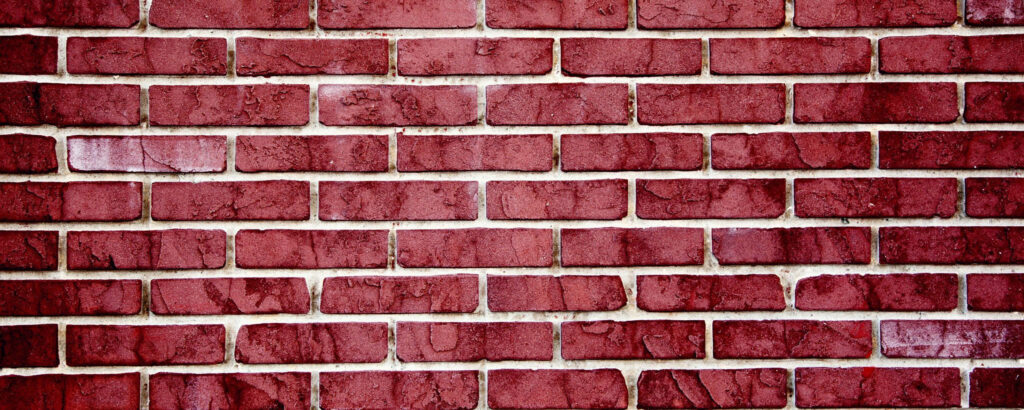 Watercolor Charm: Dazzling Red Ultra Wide HD Wallpaper of a Washed Out Brick Wall