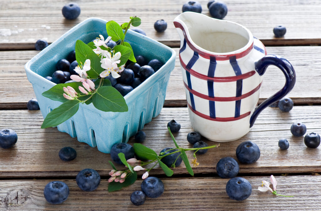 Rustic Blueberry Wallpaper: Fresh Berries & White Pitcher Design