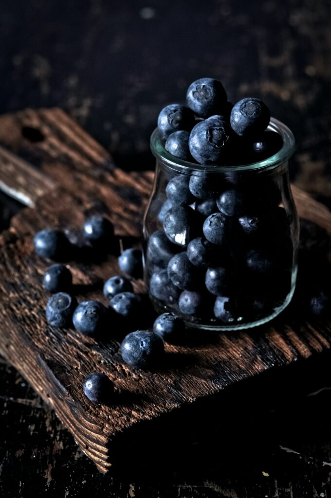 Rustic Wallpaper: Fresh Blueberries in Glass Jar on Wooden Surface