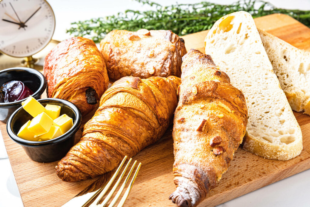 Rustic Breakfast Wallpaper: Golden Croissants & Cozy Vibes