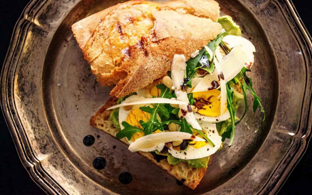 Breakfast toast with arugula sliced eggs and dressing on rustic bread wholesome meal wallpaper