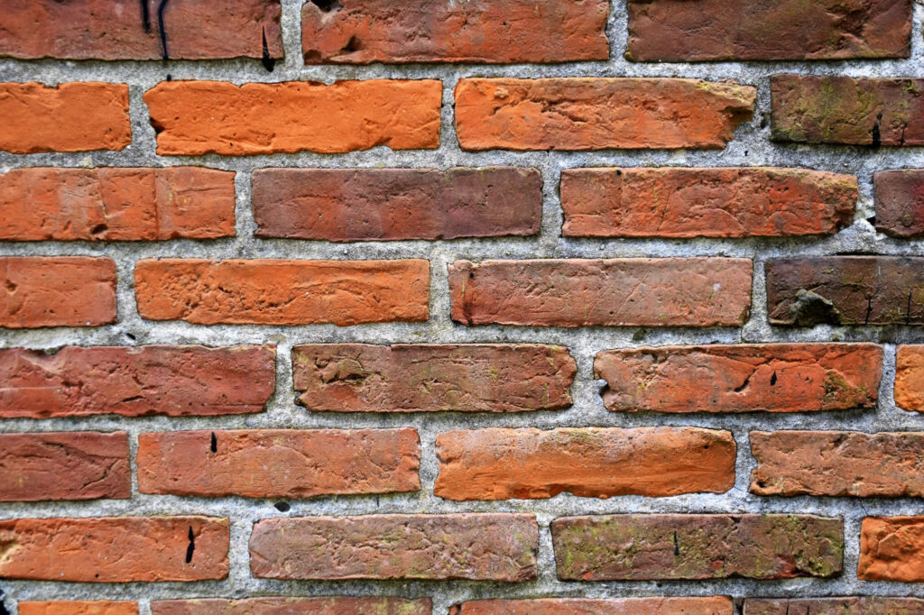 Rustic Brick Texture Close-Up: Earthy Wallpaper Background