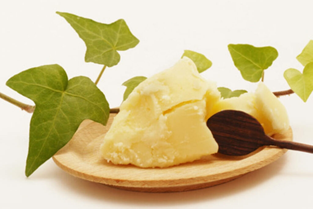 Rustic Butter Display on Wood with Fresh Green Leaves - Wallpaper