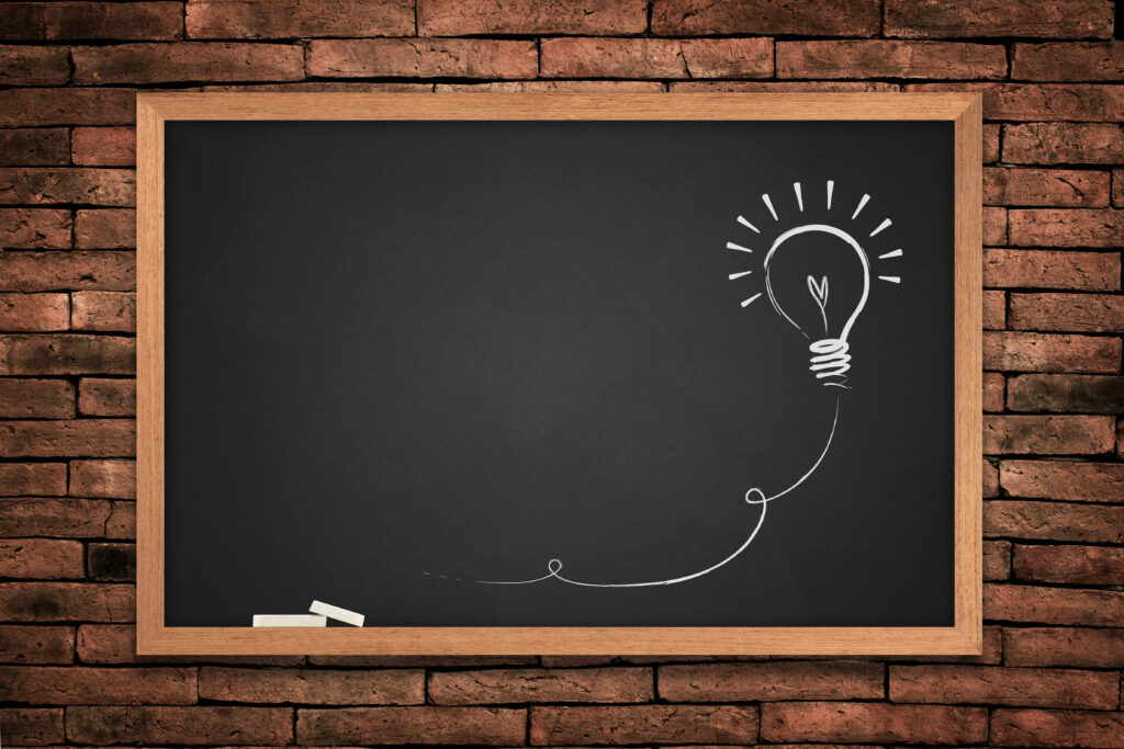 Chalk Up Your Style: Red Brick Wall Meets Chalkboard Wallpaper