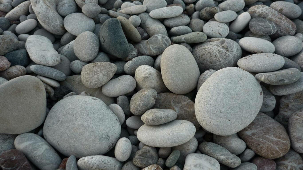 Earth's Artistry: Natural Gray Stone Texture Wallpaper for a Rustic and Calming Background Photo