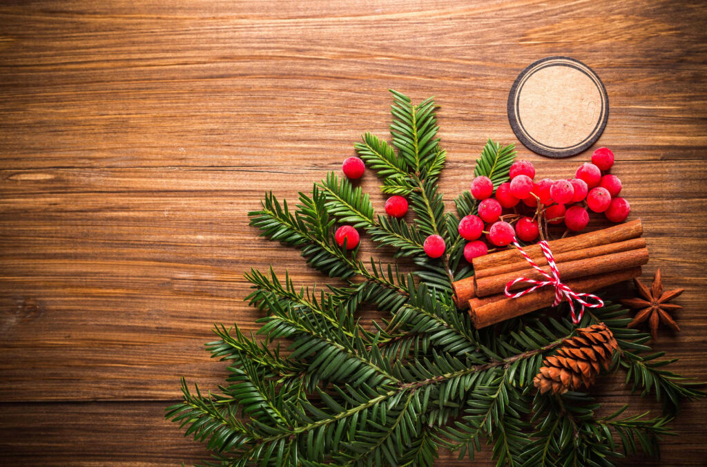 Warm Rustic Christmas Wallpaper: Pine Branches, Red Berries, & Cinnamon