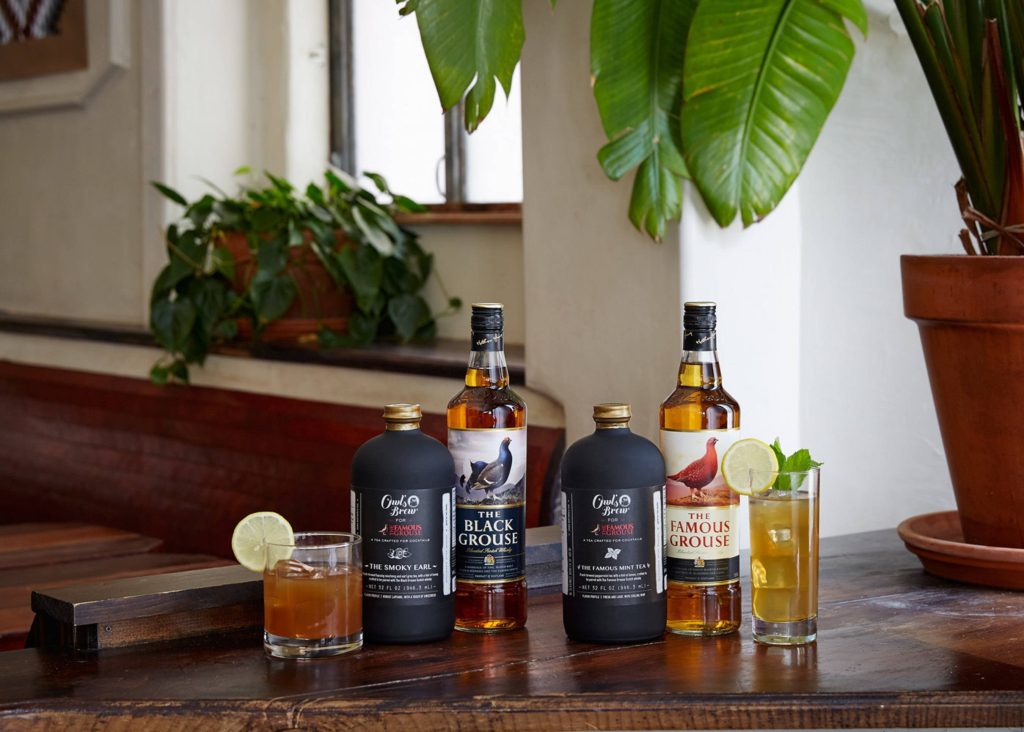 The Famous Grouse Black Grouse whisky Owl's Brew mixers lemon drinks rustic bar wallpaper background