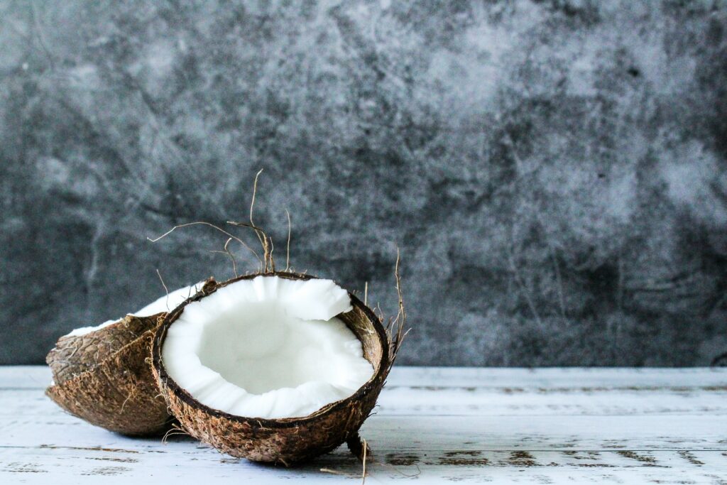 Rustic Coconut Wallpaper: Natural Beauty on Light Wooden Surface