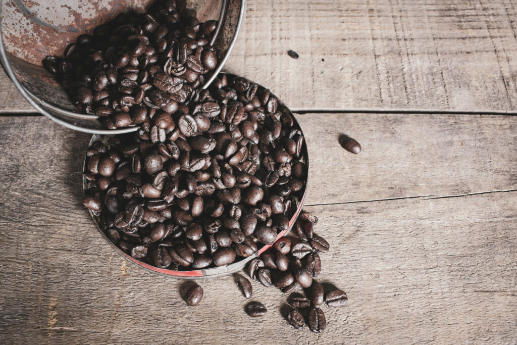 Rustic Coffee Beans Wallpaper: Textured Wooden Surface Design