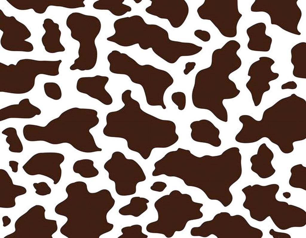 Cow print wallpaper with bold black and brown patches on white rustic farmhouse wall design