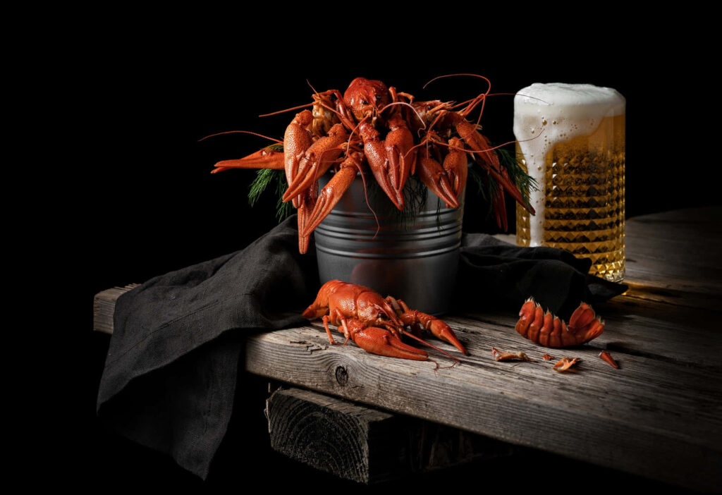 Rustic Crawfish Delight with Beer on Wooden Table Wallpaper