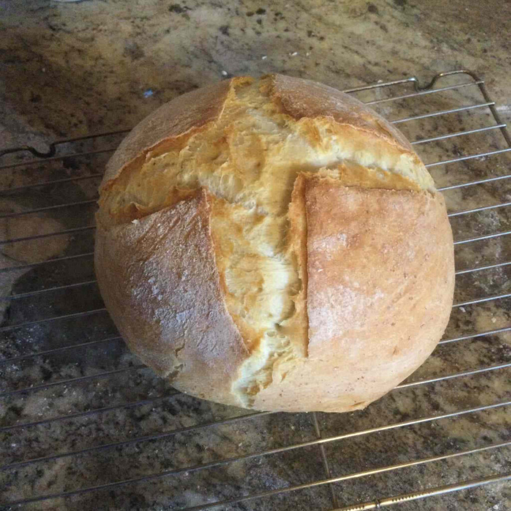Rustic Crusty Bread with Cross Pattern Cooling on Wire Rack Wallpaper