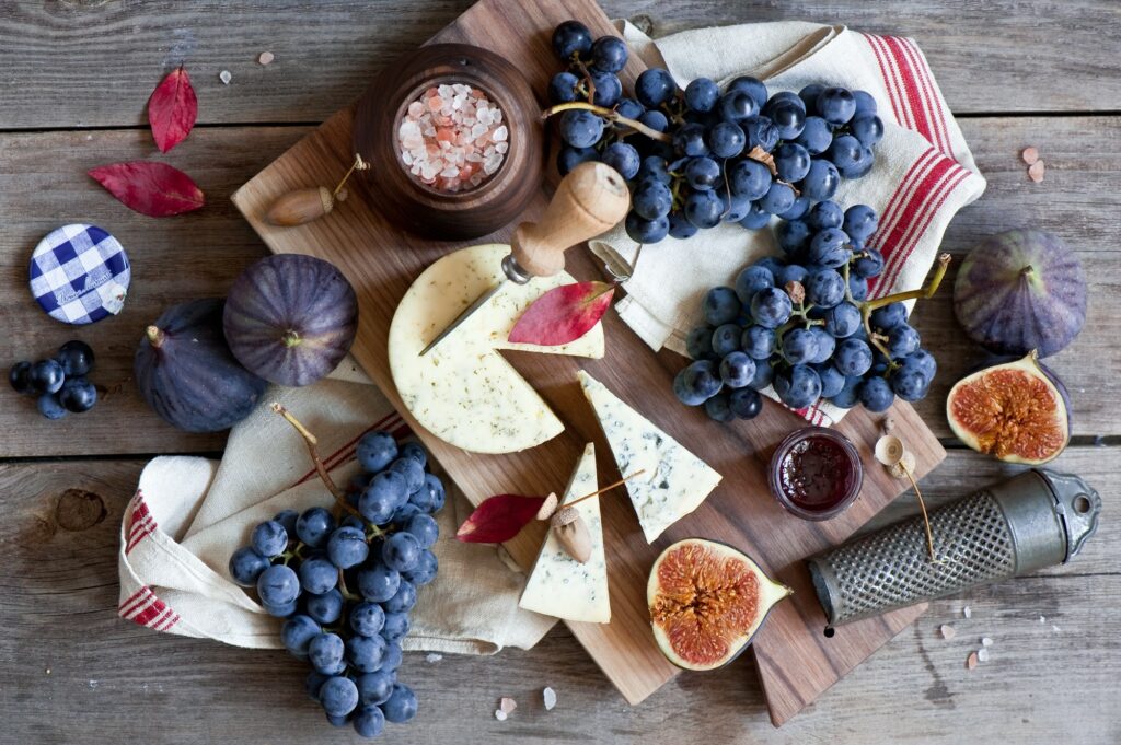 Rustic Figs, Grapes & Cheese Wallpaper: Culinary Aesthetic Background